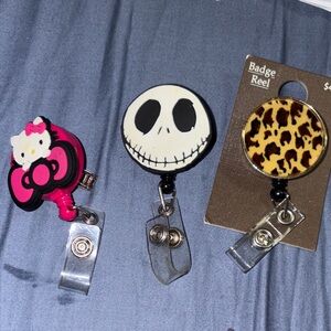 3 Badge Reels. Hello kitty, nightmare before Christmas, and leopard print.